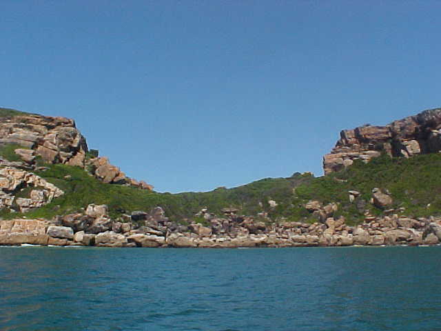 And suddenly we were on the water, sailing the bay. This image shows a part of the Robberg Peninsula. Can you imagine when there was no ocean here yet, that this gap was the river running through this area? 