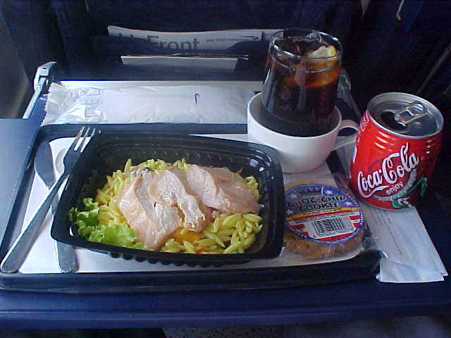 Plane food is just plain food. But I always am amazed with the real KNIFE and FORK that goes with it. And the glass was even made of REAL GLASS. Mmm, guys, what was that fuss about security and safety on board?