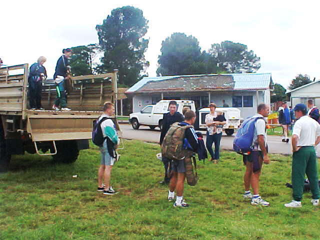 All skydivers get into the army truck that brings them to another airport.