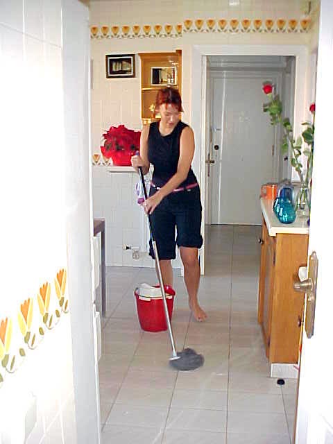 Early morning glory! Justine cleans the kitchen floor. After last nights paella cooking party it got quite sticky there...