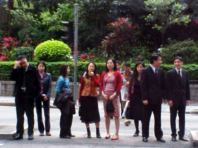 Hong Kong people at the traffic sign.