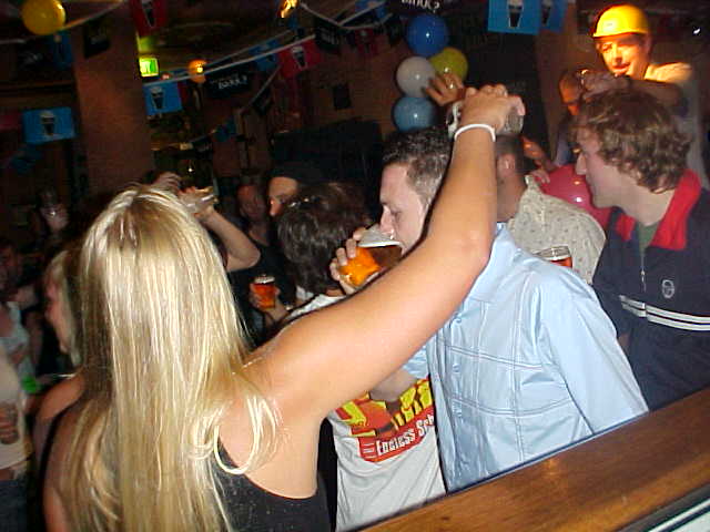 And here is where the drinking games started. Microphone-man James pumps up the action at the right.