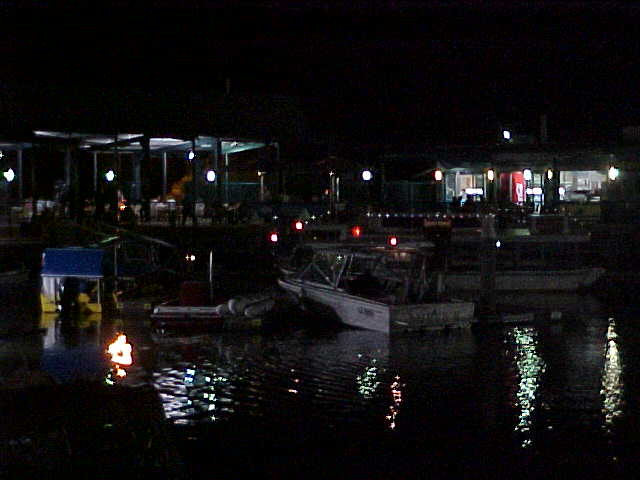 The wharf with its restaurants, at night.