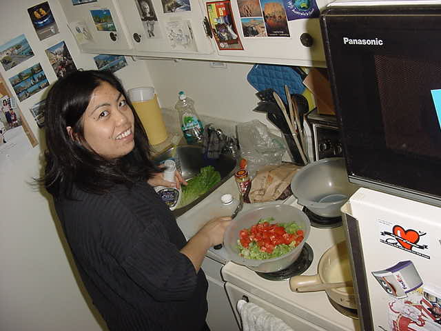Gail prepares tonights dinner in the kitchen; cheese fondue with a healthy salad!