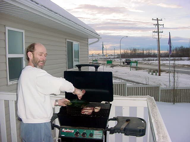 Dinner time back at the home, where Randy had lit the barbecue and threw on the meat. Ever barbecued with snow on your lawn?