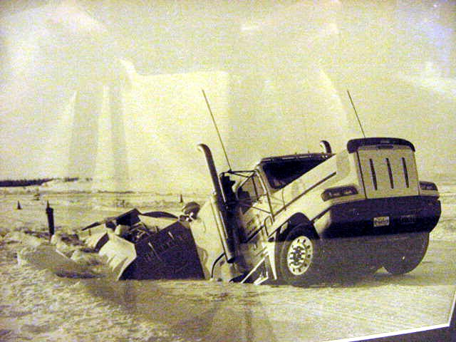 A 33 year old Alberta trucker faced a pair of charges after crashing his 61,000 kilogram fuel truck through the Fort Providence ice bridge on January 17, 2002. The truck was loaded with 48,000 litres of diesel fuel. The two trailer units of the rig were partially submerged in the incident while the cab remained on ice. The driver was able to escape without injury. All of the fuel was removed from the tanks without incident. 