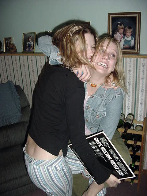 In the television room in the basement Laurie and her friend Liza go crazy for my funny camera. Dont young people behave strange?