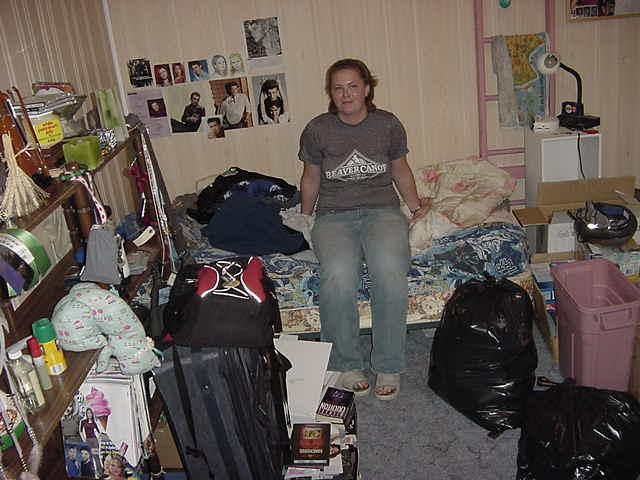 Katya in her basement bed room. 