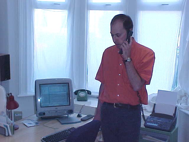 Daniele on the phone at his home office.