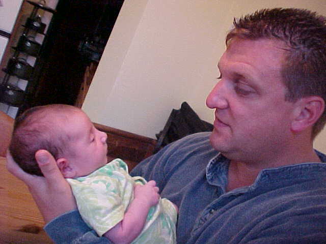 Marcus with their two weeks old daughter Molly.